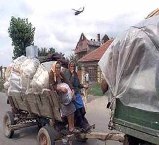 Leaving homes under US helicopters - Serbs leaving Kosovo