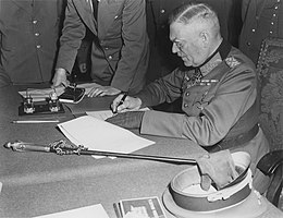 Field Marshall Keitel signs German surrender terms in Berlin 8 May 1945 - Restoration.jpg